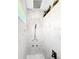 Modern tiled shower features dual shower heads and a built-in bench at 13284 Amaryllis Cir, Port Charlotte, FL 33981