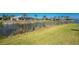This stunning waterfront property features lush green grass and gorgeous water views at 13284 Amaryllis Cir, Port Charlotte, FL 33981