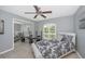 Bedroom with a large window, mirrored closet doors, and a modern ceiling fan at 13325 Ketridge Ave, Port Charlotte, FL 33953