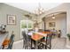Cozy dining area showcasing tile floors, arched entryways, and seamless transition to the living spaces at 13325 Ketridge Ave, Port Charlotte, FL 33953