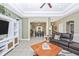 Open living room area with tile flooring, recessed lighting, and seamless transitions to other living spaces at 13325 Ketridge Ave, Port Charlotte, FL 33953