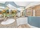 Elegant bathroom featuring dual sinks with granite counters, spacious vanity, and a glass-enclosed shower at 13325 Ketridge Ave, Port Charlotte, FL 33953