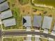 An aerial view shows the roof of a home with solar panels and landscaping in a modern residential neighborhood at 16440 Marsh Ln, Punta Gorda, FL 33982