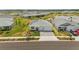 Charming single-Gathering home with well-manicured landscaping, a paved driveway, and solar panels on the roof at 16440 Marsh Ln, Punta Gorda, FL 33982