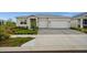 Charming single-story home with a well-maintained lawn and a two-car garage, offering curb appeal and convenience at 16440 Marsh Ln, Punta Gorda, FL 33982