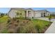 A cozy home featuring a manicured lawn and beautiful landscaping, creating a welcoming outdoor space at 16440 Marsh Ln, Punta Gorda, FL 33982