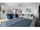 Bright and open living room adjacent to kitchen; neutral furniture and decor with large windows at 16440 Marsh Ln, Punta Gorda, FL 33982