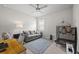 Bright living room featuring a comfortable sofa, ceiling fan, and view to the outside at 16440 Marsh Ln, Punta Gorda, FL 33982