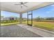 Enjoy outdoor living on the screened patio, offering a relaxing space with views of the beautifully landscaped backyard at 16440 Marsh Ln, Punta Gorda, FL 33982