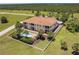 Stunning aerial view of home featuring a pool, balcony, lush landscaping, and serene surroundings at 16572 San Edmundo Rd # 111, Punta Gorda, FL 33955