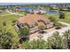 Scenic aerial view of home featuring tile roofing, attached garages, and a calming lake at 16572 San Edmundo Rd # 111, Punta Gorda, FL 33955