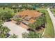 Picturesque aerial view of home showcasing tile roofing, attached garages, and a serene landscape at 16572 San Edmundo Rd # 111, Punta Gorda, FL 33955