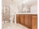 Bathroom featuring tiled shower and dual sink vanity at 16572 San Edmundo Rd # 111, Punta Gorda, FL 33955