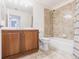 Bathroom with vanity and tiled shower at 16572 San Edmundo Rd # 111, Punta Gorda, FL 33955