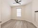 Bright bedroom with one window and light wood-look flooring at 16572 San Edmundo Rd # 111, Punta Gorda, FL 33955