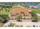 Attractive townhome with red tile roof and multiple car garages and brick paved driveway at 16572 San Edmundo Rd # 111, Punta Gorda, FL 33955
