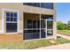 This property features a screened lanai with a view of lush foliage and a well-manicured lawn at 16572 San Edmundo Rd # 111, Punta Gorda, FL 33955