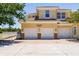 Three car garage and address of the home with lush green trees surrounding the building at 16572 San Edmundo Rd # 111, Punta Gorda, FL 33955
