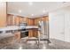 Well-lit kitchen with stainless steel appliances and granite countertops at 16572 San Edmundo Rd # 111, Punta Gorda, FL 33955