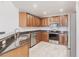 Well-lit kitchen with stainless steel appliances and granite countertops at 16572 San Edmundo Rd # 111, Punta Gorda, FL 33955