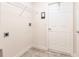 A utilitarian laundry room with shelving at 16572 San Edmundo Rd # 111, Punta Gorda, FL 33955