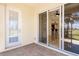 Step onto the patio, offering a glimpse of the kitchen and a seamless transition to the screened lanai at 16572 San Edmundo Rd # 111, Punta Gorda, FL 33955