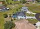 Aerial view of the home, featuring a serene backyard, private pool, and lush landscaping at 17304 Vagabond Cir, Punta Gorda, FL 33955
