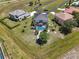 Aerial shot of a landscaped backyard with a dark roof and a screened pool at 17304 Vagabond Cir, Punta Gorda, FL 33955