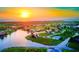 Panoramic aerial view of a beautiful waterfront community with lakes and canals at sunrise at 17304 Vagabond Cir, Punta Gorda, FL 33955