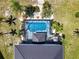 Overhead view of the home's pool, outdoor living space, and beautifully landscaped backyard at 17304 Vagabond Cir, Punta Gorda, FL 33955