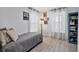 Bedroom features wood floors, natural light, and a blue bookshelf at 17304 Vagabond Cir, Punta Gorda, FL 33955