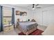 Cozy bedroom featuring a ceiling fan, carpet, and an area rug at 17304 Vagabond Cir, Punta Gorda, FL 33955