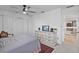 Bedroom features a ceiling fan, closet, and a light colored area rug at 17304 Vagabond Cir, Punta Gorda, FL 33955