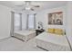 Inviting bedroom with natural light, ceiling fan, and comfortable furnishings, offering a cozy retreat at 17304 Vagabond Cir, Punta Gorda, FL 33955