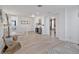 Bright hallway with wood floors, white walls and trim, and a clear view of the home's layout at 17304 Vagabond Cir, Punta Gorda, FL 33955