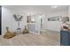 Bright hallway with neutral walls, modern decor, light hardwood floors and a charming stairway at 17304 Vagabond Cir, Punta Gorda, FL 33955
