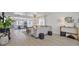 Spacious living room with light wood floors, comfortable seating, and plenty of natural light at 17304 Vagabond Cir, Punta Gorda, FL 33955