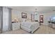 Bright main bedroom with hardwood floors, TV, and a large, comfortable bed at 17304 Vagabond Cir, Punta Gorda, FL 33955