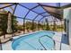 View of a screened in pool, and an outdoor patio with furniture at 17304 Vagabond Cir, Punta Gorda, FL 33955