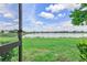 Beautiful backyard view of the pond and sky, perfect for relaxing at 17620 Winding Wood Ln, Punta Gorda, FL 33982