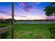 Beautiful backyard view of the pond and sky, perfect for relaxing at 17620 Winding Wood Ln, Punta Gorda, FL 33982