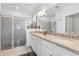 Beautiful bathroom with granite countertops, dual sinks, and a glass-enclosed shower at 17620 Winding Wood Ln, Punta Gorda, FL 33982