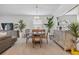 Elegant dining room with chandelier, ornamental plants, and stylish table setting at 17620 Winding Wood Ln, Punta Gorda, FL 33982