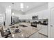 Beautiful kitchen features stainless steel appliances, granite countertops, and center island with bar stools at 17620 Winding Wood Ln, Punta Gorda, FL 33982