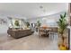 Open living space with dining area, couch, and view of backyard at 17620 Winding Wood Ln, Punta Gorda, FL 33982