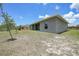 View of the rear exterior of the home and backyard at 18503 Ellen Ave, Port Charlotte, FL 33948