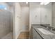 Bright bathroom featuring granite vanity and tiled shower at 18503 Ellen Ave, Port Charlotte, FL 33948