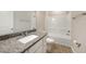 Bathroom featuring a granite vanity and bath tub at 18503 Ellen Ave, Port Charlotte, FL 33948