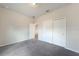 Neutral bedroom featuring closet with sliding doors and interior hallway at 18503 Ellen Ave, Port Charlotte, FL 33948