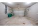 Spacious garage with a roll-up door and ample room for parking at 18503 Ellen Ave, Port Charlotte, FL 33948
